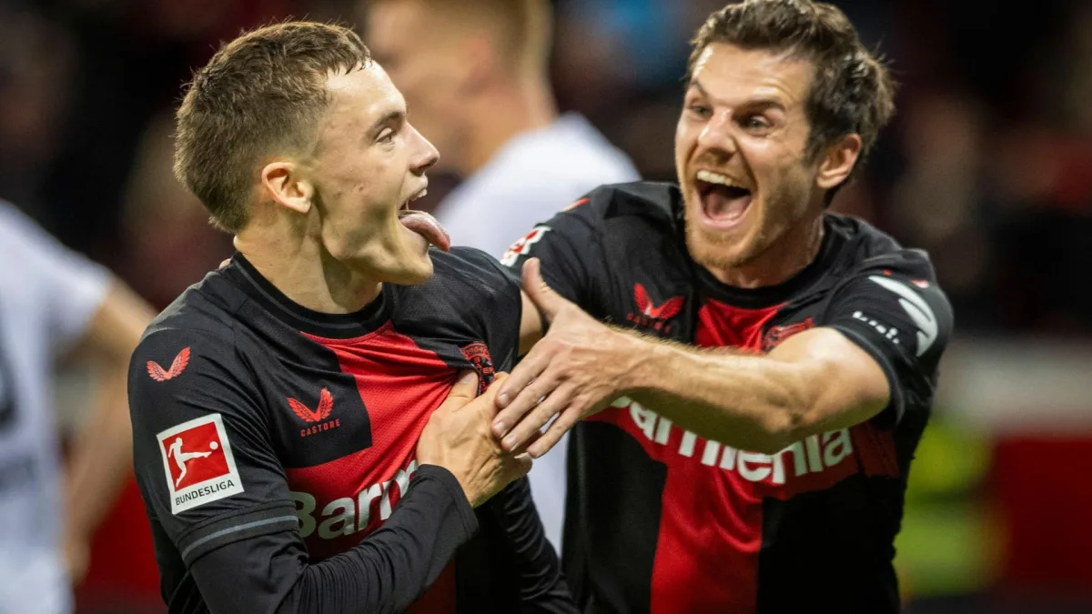 Florian Wirtz and Jonas Hofmann celebrate scoring for Bayer against Freiburg