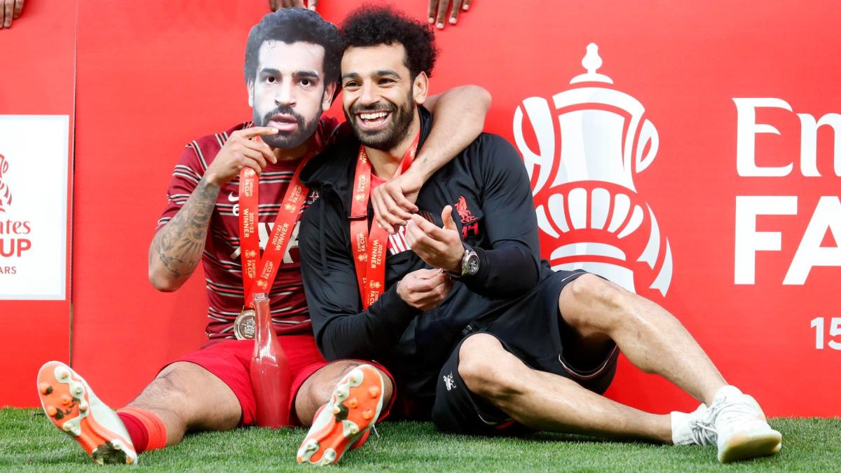 Mohamed Salah and Thiago Alcantara celebrate winning the 2022 FA Cup final with Liverpool