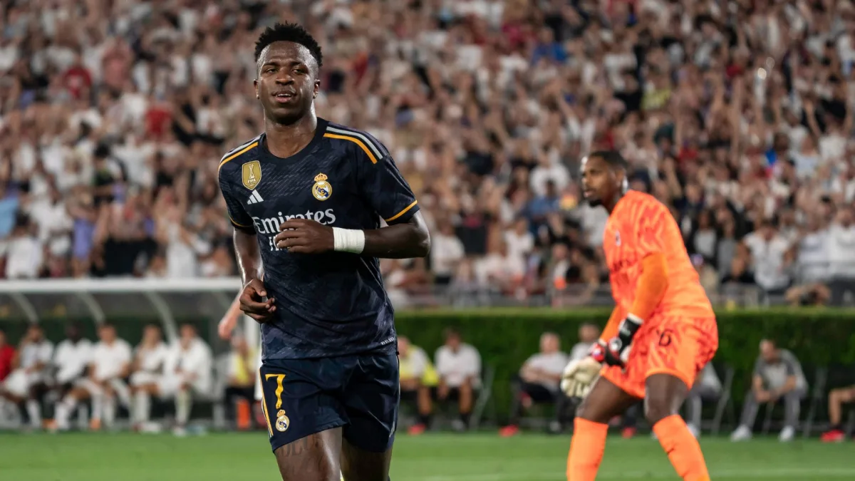 Vinicius Junior celebrates scoring against AC Milan for Real Madrid