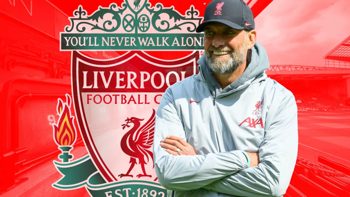 Jurgen Klopp and the Liverpool badge, in front of a panorama of Anfield in red
