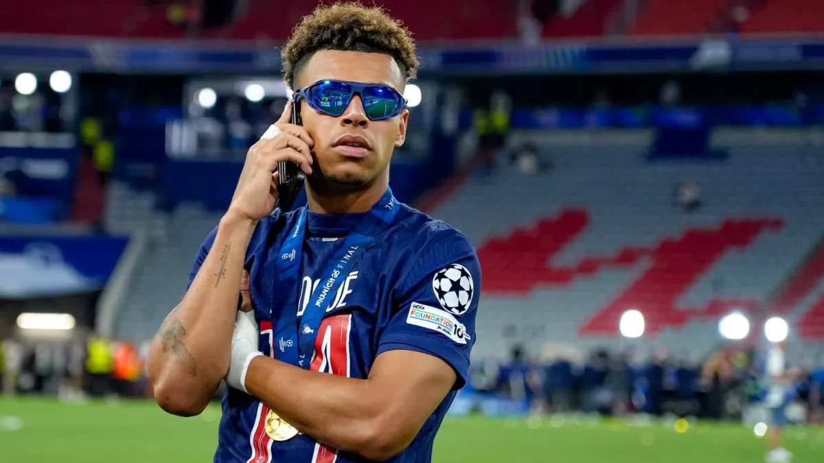 Desire Doue celebrates winning the Champions League with PSG