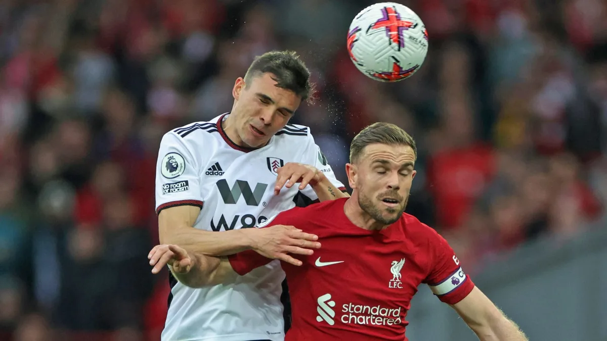 Joao Palhinha and Jordan Henderson competing for possession.