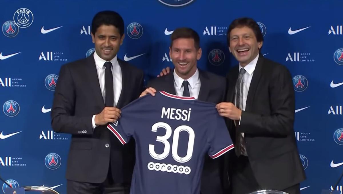 Lionel Messi at his PSG presentation with Nasser Al-Khelaifi and Leonardo