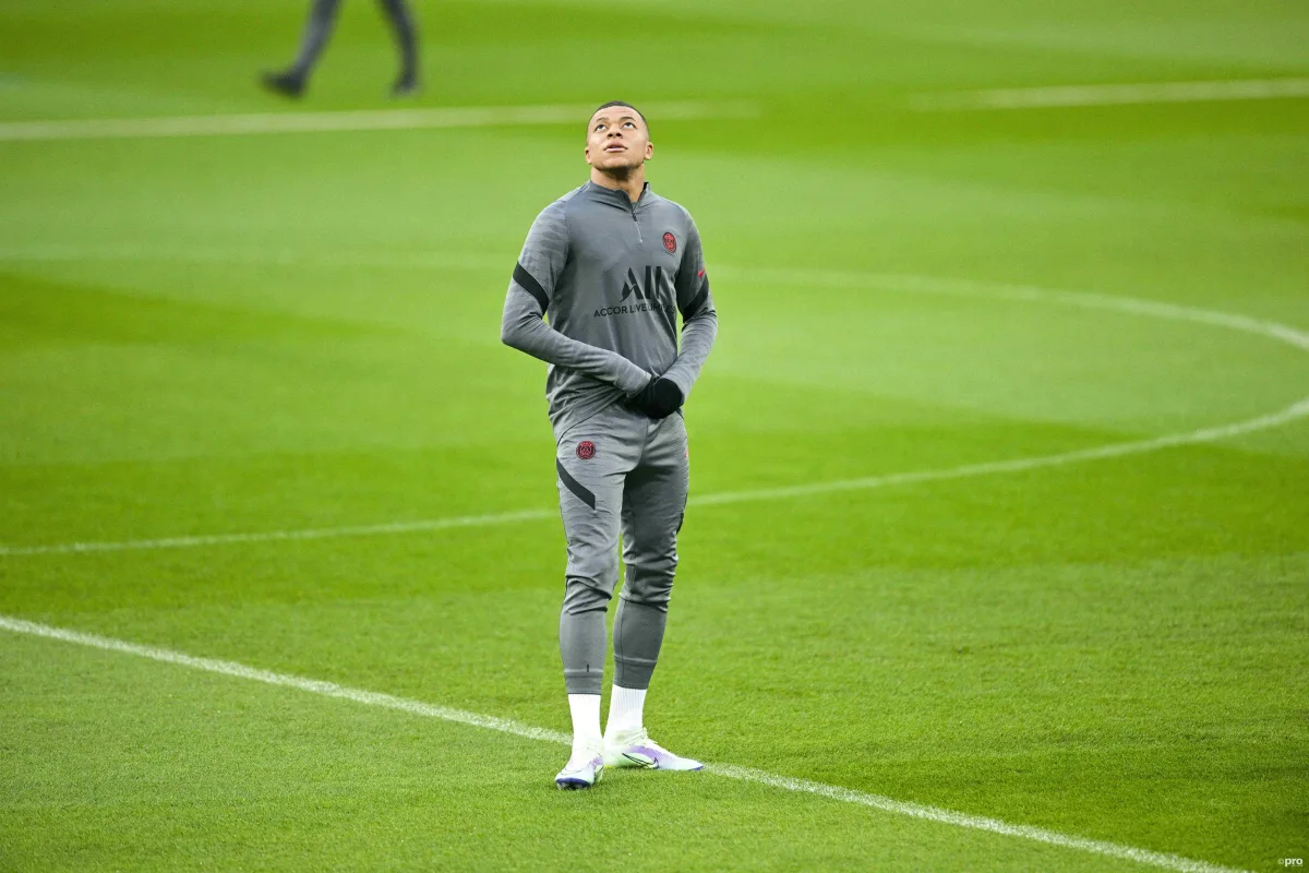 Kylian Mbappe looks at Real Madrid's Bernabeu stadium