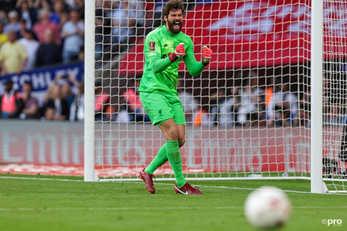 Alisson celebrates as Liverpool win the FA Cup on penalties.