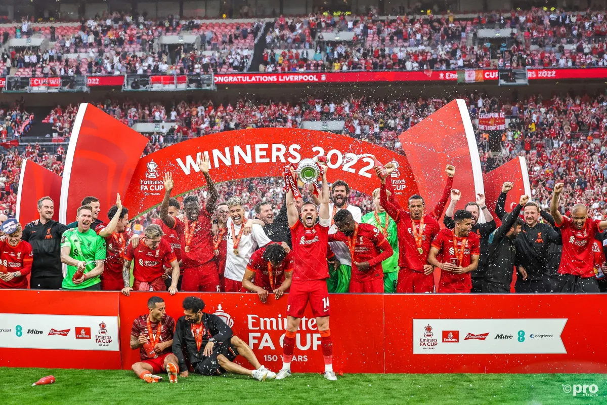 Liverpool lift the FA Cup trophy after defeating Chelsea on penalties.