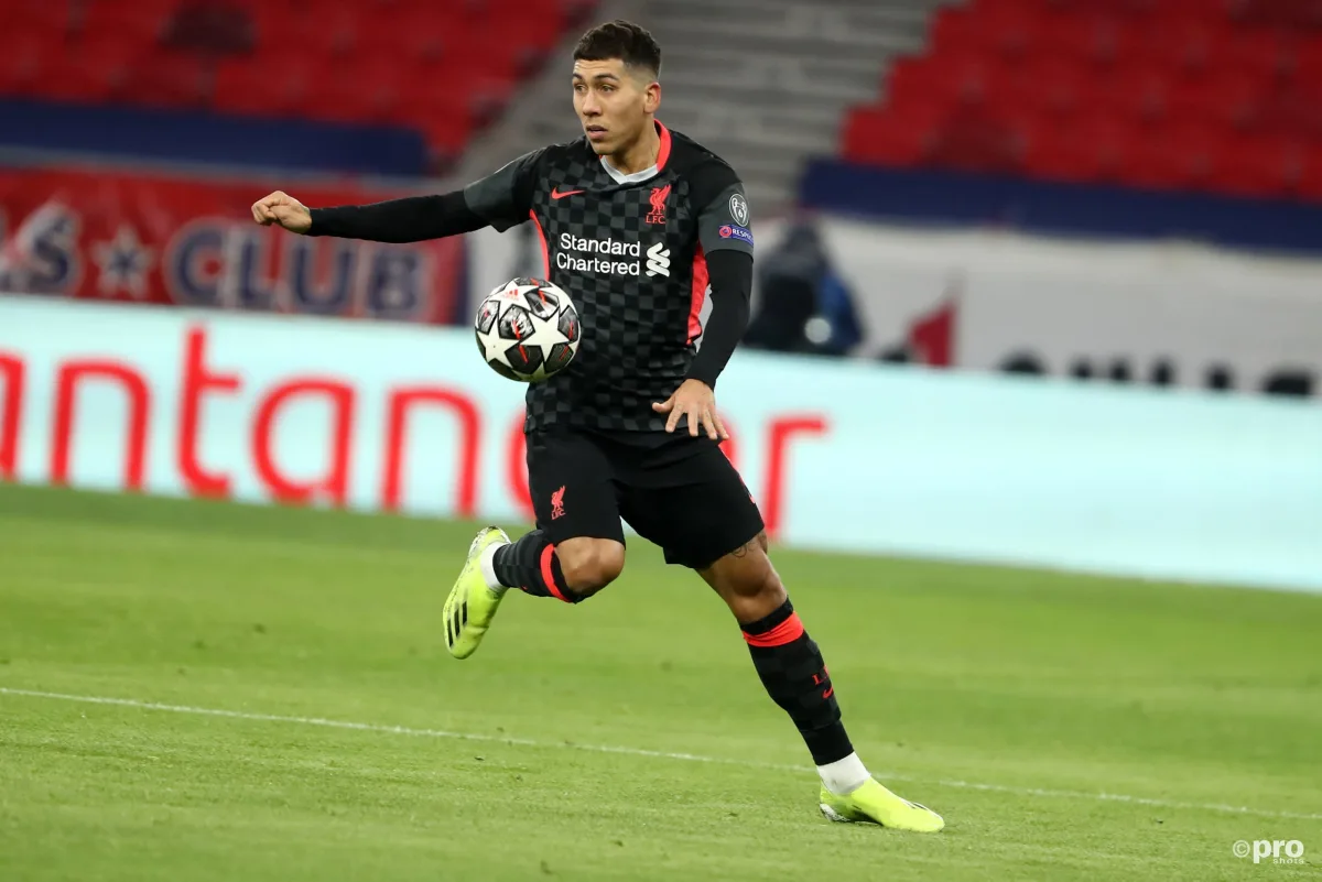 Roberto Firmino controls the ball for Liverpool against RB Leipzig in the UEFA Champions League Round of 16 at the Puskas Arena in 2021 
