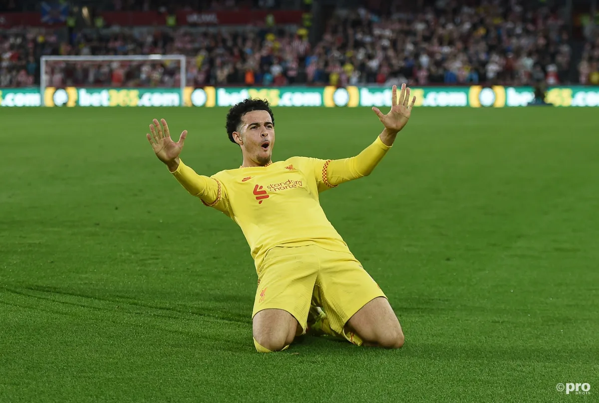 Curtis Jones celebrates scoring a goal for Liverpool in a Premier League match at Brentford Community Stadium against Brentford in 2021