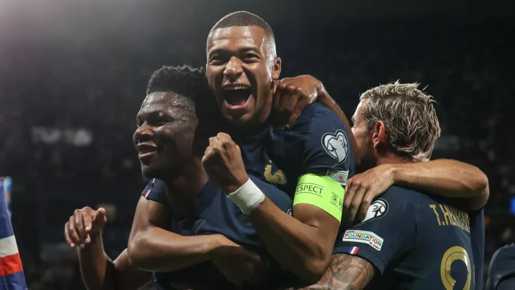 Mbappe celebrating a France goal with Real Madrid's Aurelien Tchouameni