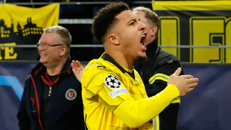 Jadon Sancho celebrates scoring in the Champions League