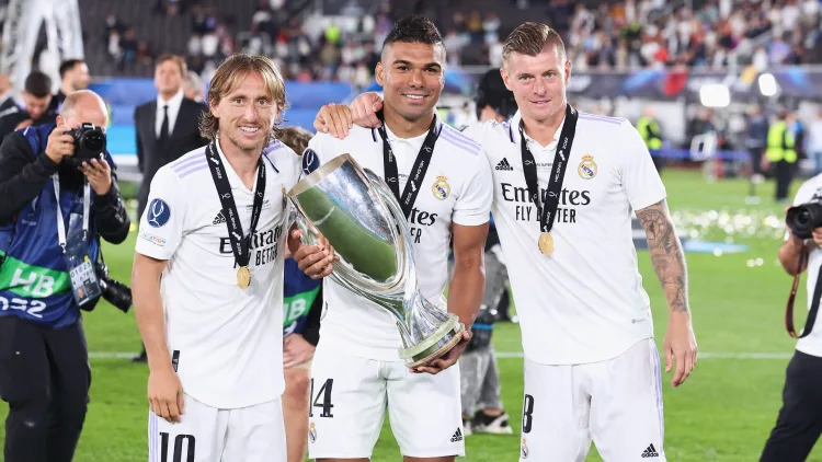 Luka Modric (left) with Casemiro (centre) and Toni Kroos (right)