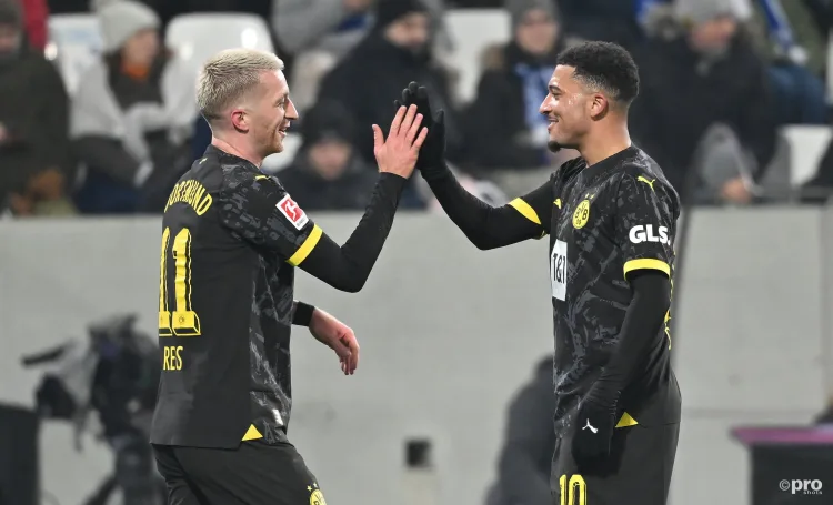 Jadon Sancho (right) celebrates with Marco Reus after assisting his goal for Dortmund.